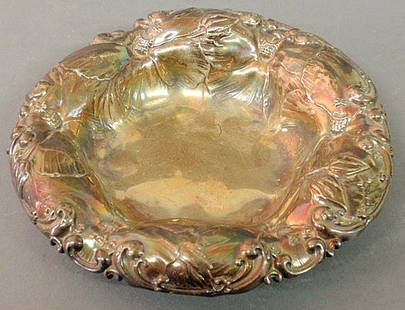 Whiting round sterling silver bowl, c.1910, the sh: - Whiting round sterling silver bowl, c.1910, the shaped rim with Art Nouveau scroll and water lily decoration. 5.5”dia., 3 troy oz.