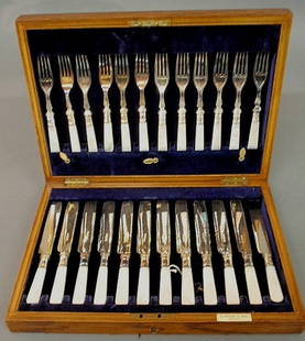Mother-of-pearl handled and silver-plated flatware: - Mother-of-pearl handled and silver-plated flatware dessert service, G. Seifert & Sons, Quebec, with twelve forks and twelve knives all in oak case.