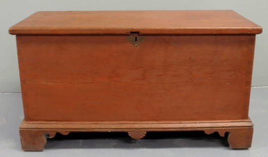 Pine blanket chest, c.1820, with old red wash and: Pine blanket chest, c.1820, with old red wash and unusual center carved drop and straight bracket feet. 20.5"h.x27.5"w.x17"d.