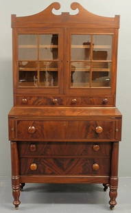 Baltimore mahogany two-piece secretary bookcase,: Baltimore mahogany two-piece secretary bookcase, c.1820, with a broken arch bonnet and fold-down writing surface. 71"h.x37"w.x19.5"d.