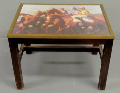 Small black wood table, 20th c., with a painted r: Small black wood table, 20th c., with a painted racehorse and jockey top under glass and with a brass edge. 19"h.x25"w.x18.75"d.