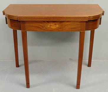 Hepplewhite style inlaid mahogany card table with: Hepplewhite style inlaid mahogany card table with shell decoration. 29"h.x36"w.x18"d.