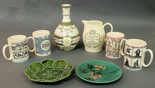 Group of Wedgwood porcelain to include 4 Queenswa: Group of Wedgwood porcelain to include 4 Queensware commemorative mugs and a pitcher, an Argentaware majolica bottle-form vase and two majolica plates.