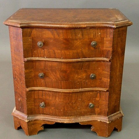 Continental style miniature walnut chest of drawe: Continental style miniature walnut chest of drawers, 20th c. 17"h.x15"w.x11"d.