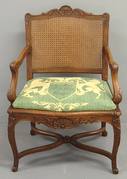 French walnut cane-back bergère, 20th c. 36'h.x25: French walnut cane-back bergère, 20th c. 36'h.x25"w.x23"d., seat 18"h.