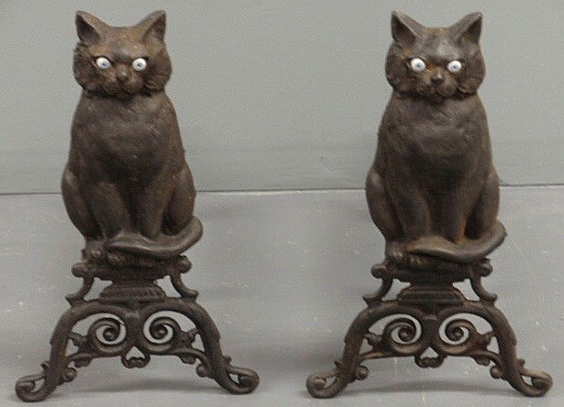 Pair of Victorian seated cat andirons with marble: Pair of Victorian seated cat andirons with marble eyes. 17"h.x10"w.x17"d.
