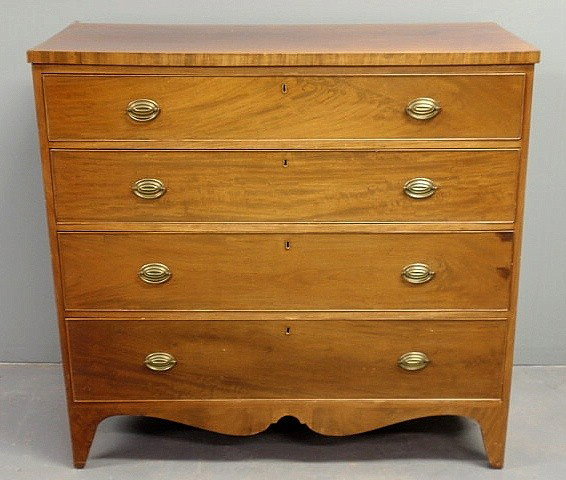 New York Hepplewhite mahogany chest of drawers, c: New York Hepplewhite mahogany chest of drawers, c.1790, with a scalloped skirt, French feet and original brasses. 42"h.x44"w.x19.25"d.