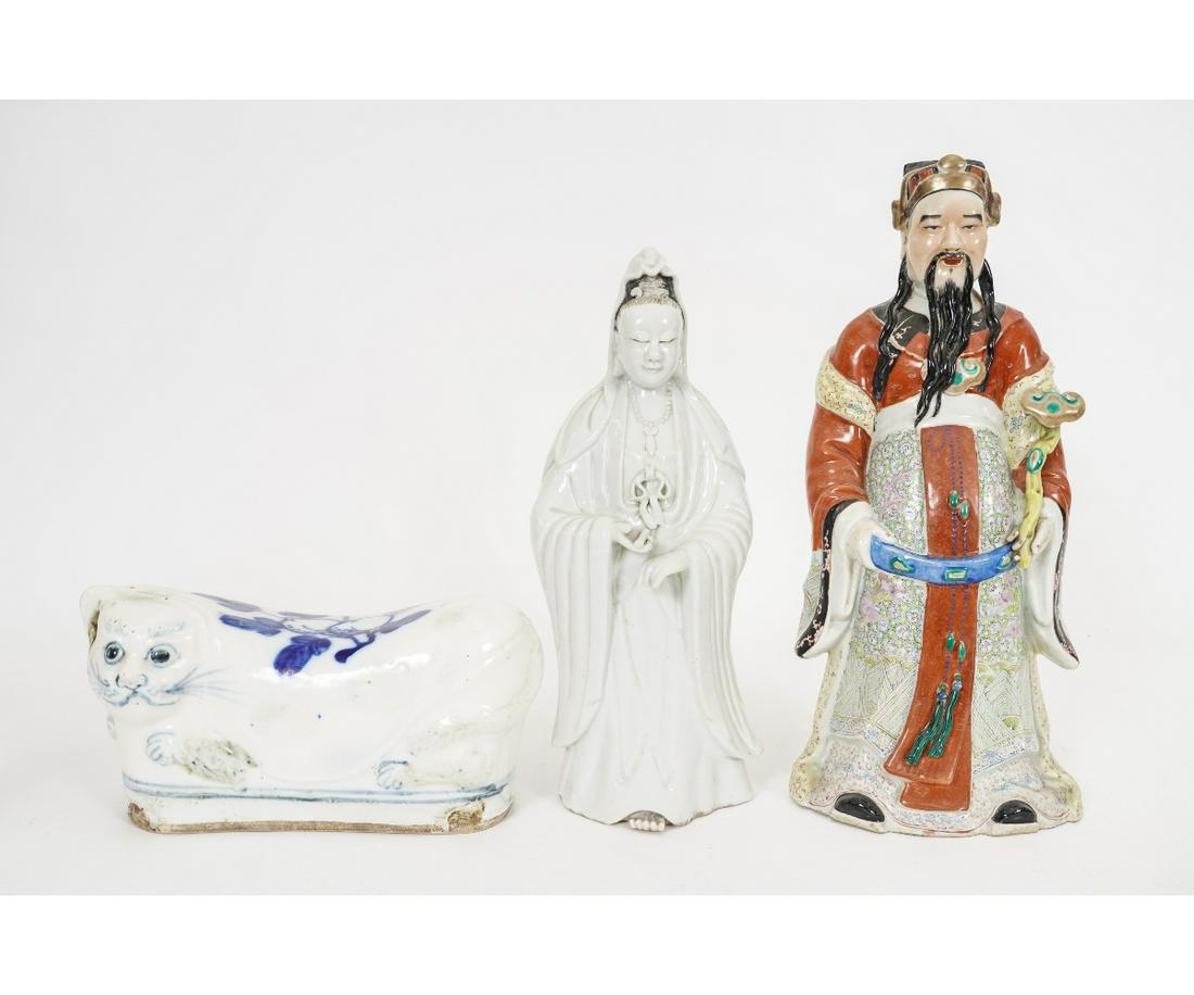 CHINESE PORCELAIN: Chinese porcelain to include an opium pillow, signed; together with a blanc-de-chine figure and a nobility figure holding a ruyi, signed.Pillow: 5.5"h x 11"lTallest firgure:16"h
