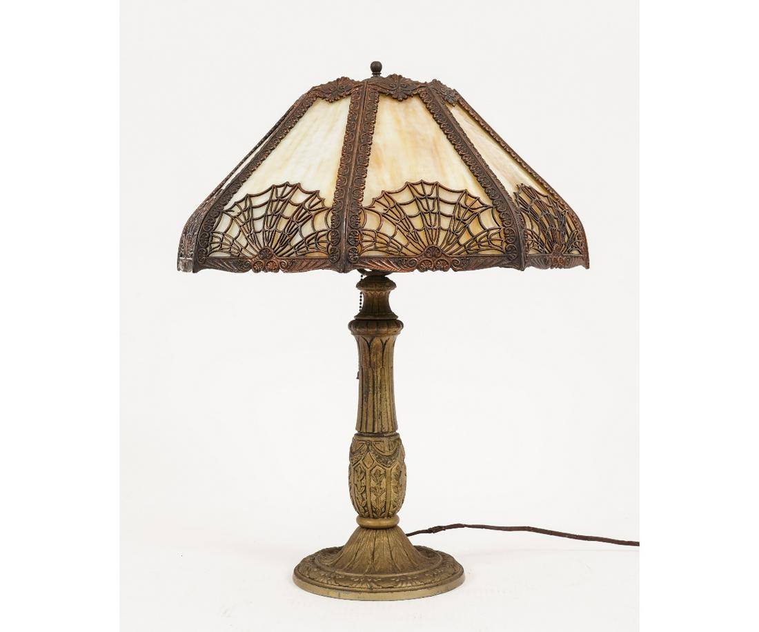 SPIDER WEB SLAG GLASS LAMP: Spider web filigree caramel color slag glass lamp with eight panel shade and metal base. 24"h x 19"dia