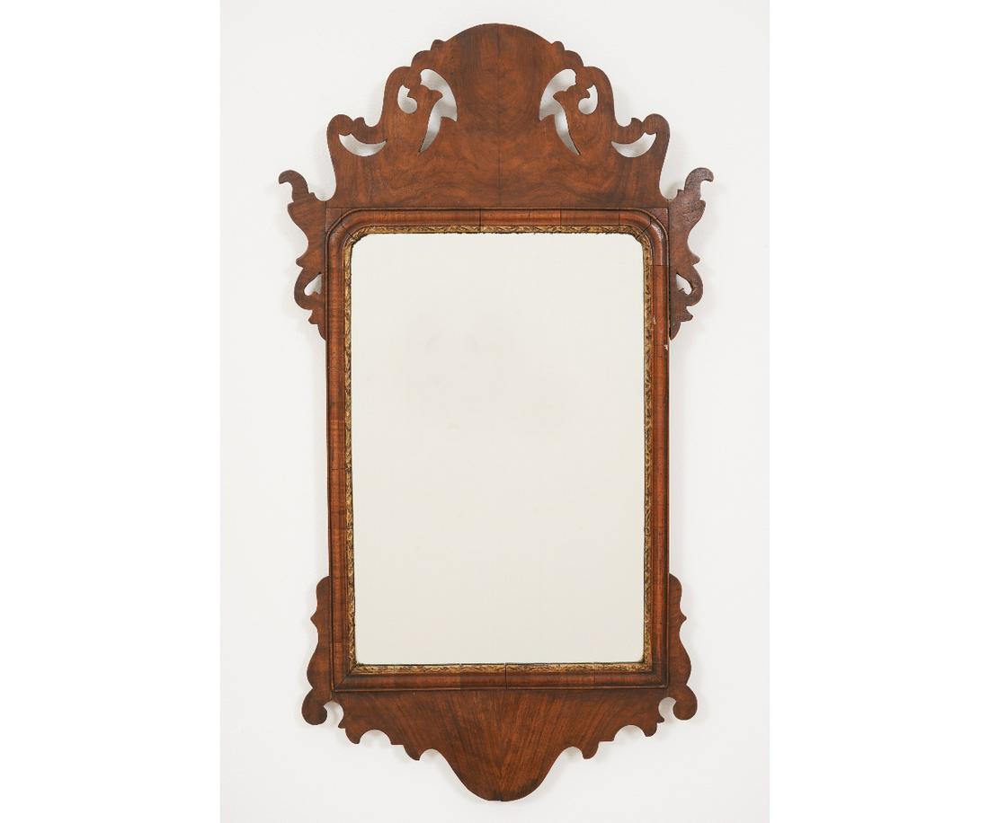 CHIPPENDALE MAHOGANY MIRROR: Chippendale mahogany mirror, circa 1780, with carved crest and ears. 30"h x 17"w