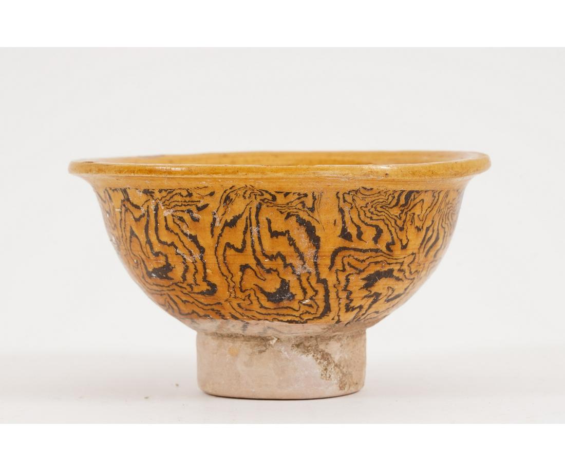 CHINESE YELLOW GLAZED BOWL: Chinese yellow glazed earthenware bowl with black/brown decoration. 2.5"h x 4.25"dia