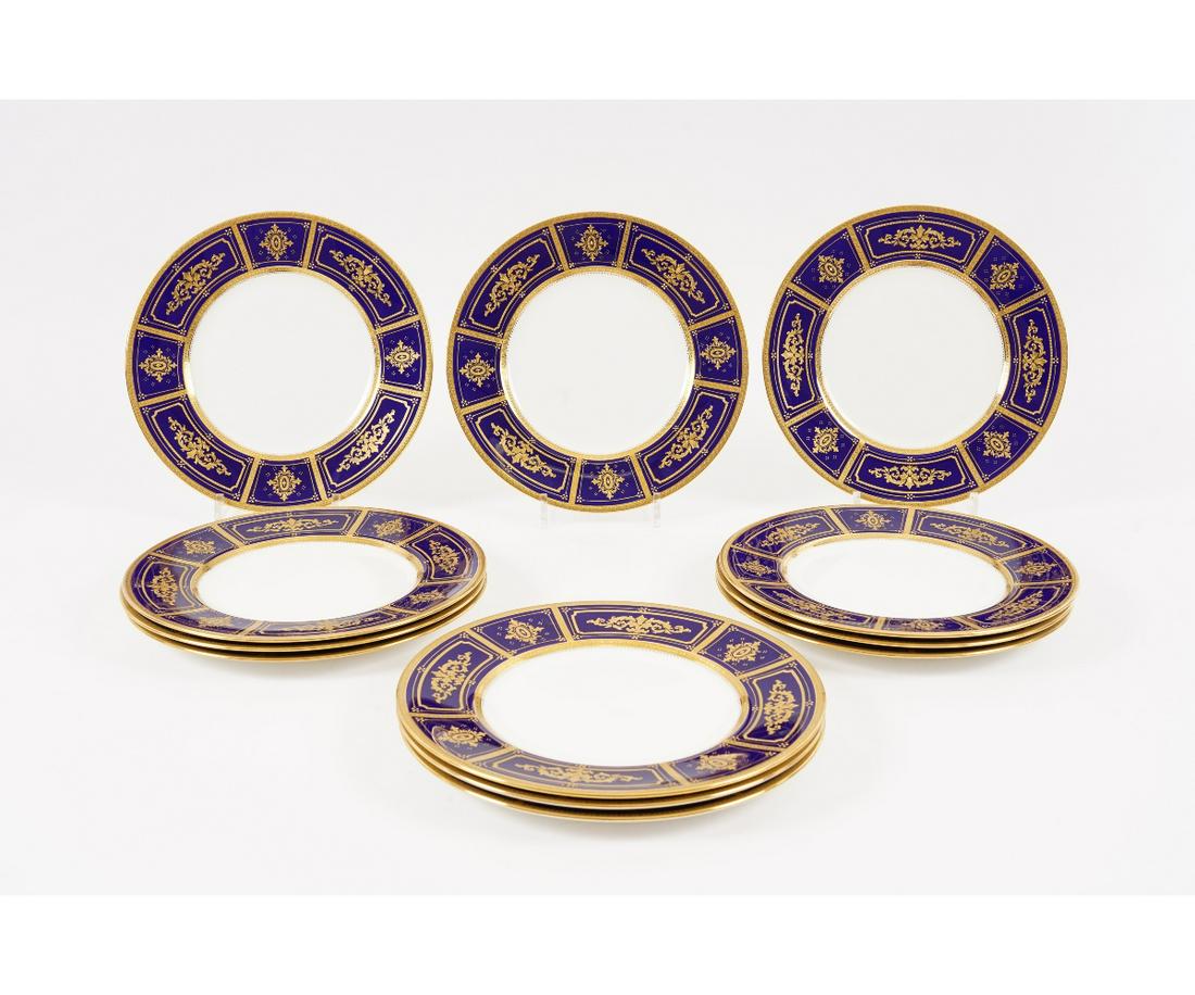 SET OF TWELVE MINTON PLATES: Set of 12 Minton plates each with cobalt blue panels with fine gilt decoration retailed by Tiffany & Co., NY. 10.75"dia