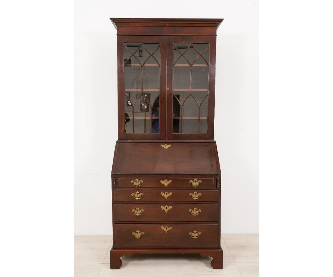 GEORGIAN MAHOGANY SECRETARY BOOKCASE: Georgian mahogany two-part secretary bookcase with molded cornice, fitted interior and straight bracket feet.