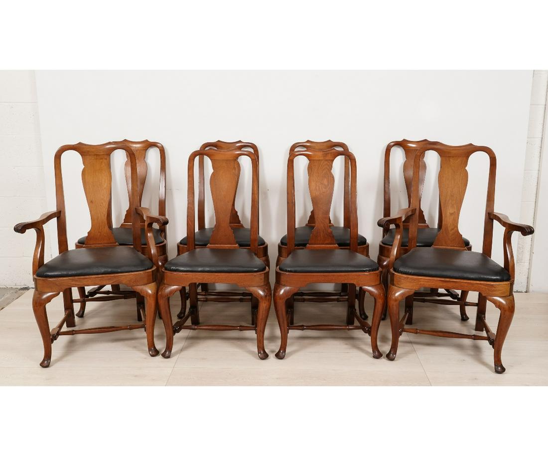 SET OF EIGHT DINING CHAIRS: Set of eight Queen Anne style mahogany dining chairs each with black leather slip seats, two armchairs and 6 side chairs. Arm: 40"h x 29"w x 19"d / 18" SH Side: 39.25"h x 21"w x 17"d / 18" SH