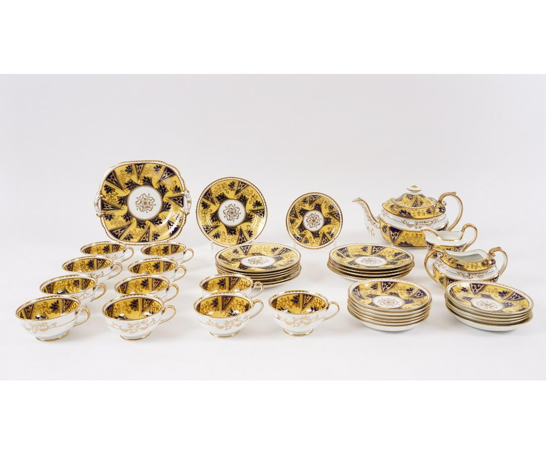 ROCKINGHAM PARTIAL CHINA SERVICE: Rockingham Works partial china service to include a teapot (damaged); a sugar bowl (no lid); creamer, cups and saucers. 39 pieces. Teapot: 6"h
