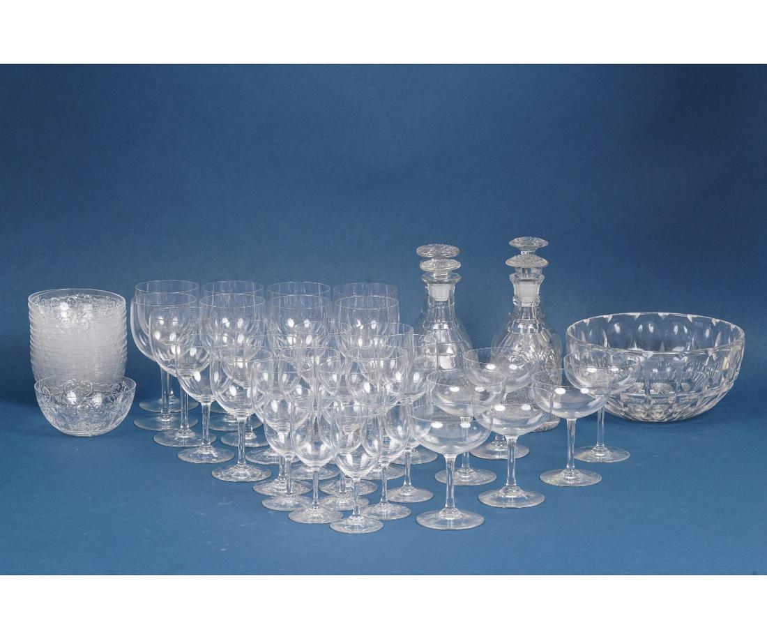 BACCARAT GLASS FINGER BOWLS: Twelve Baccarat France glass finger bowls, 6.5"h; together with thirty-three Baccarat glasses; four cut glass decanters, 8.5"h and a glass bowl, 4"h x 9.25"dia.