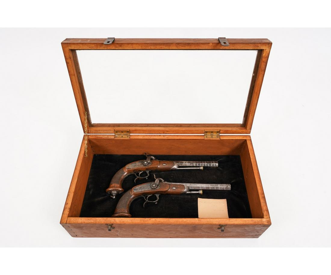 PAIR OF FRENCH CAVALRY PISTOLS: Pair of French cavalry Chatellerault model 1833, single shot percussion pistols, probably .69 caliber, each 15"l, mounted in a newer wood case, 6.5"h x 21.5"w x 11.75"d.