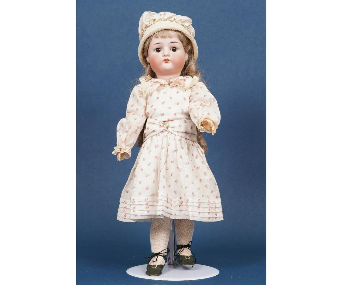 GERMAN BISQUE HEAD DOLL: German bisque head doll, model 1912-4, with jointed composition body, repainted, 22"h.