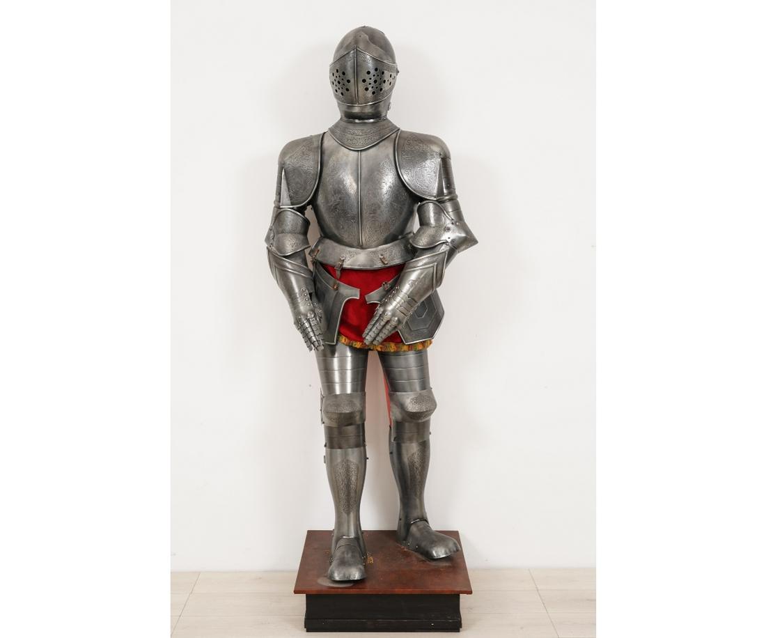 SPANISH STYLE SUIT OF ARMOR: Spanish style metal full suit of armor, 20th c., mounted on a wooden base. 68"h x 22"w x 11.5"d (armor only)
