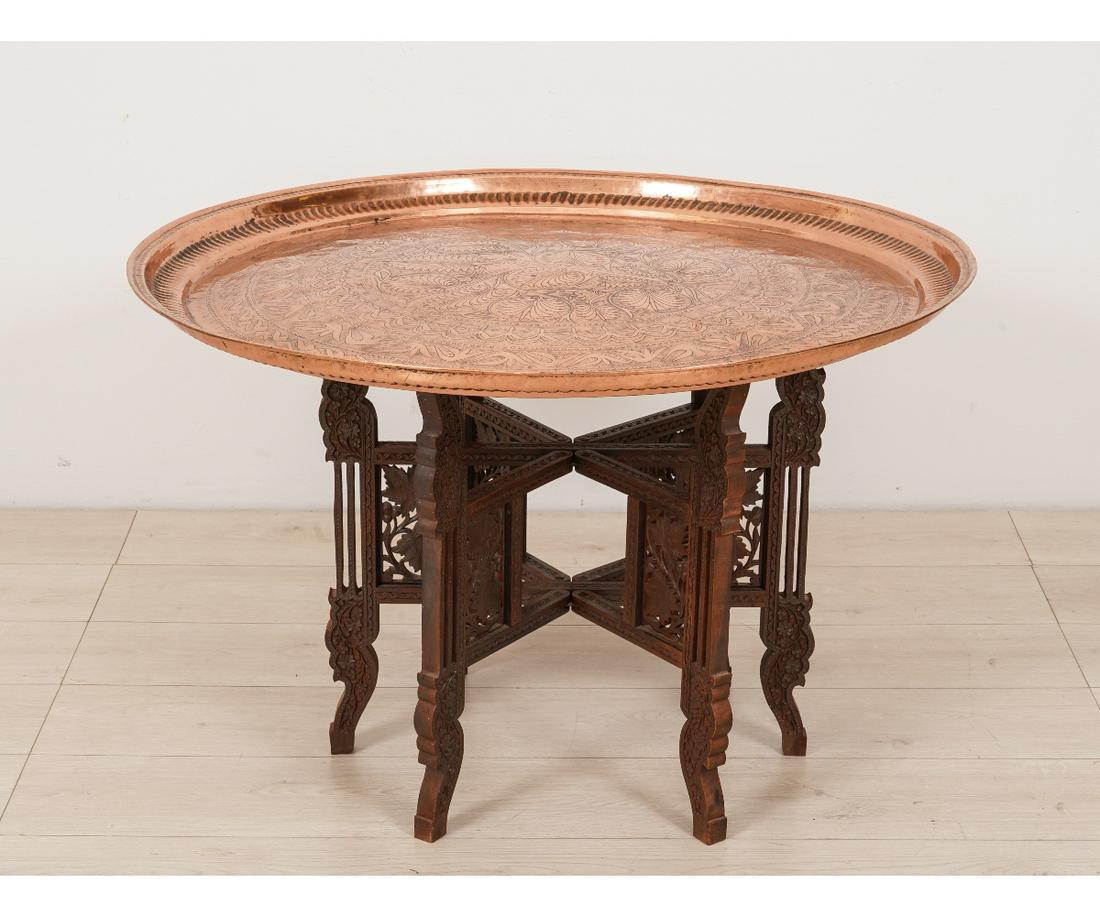 INDIAN COPPER TRAY TABLE: Indian copper round tray table with teak style carved base. 21.5"h x 34.5"dia
