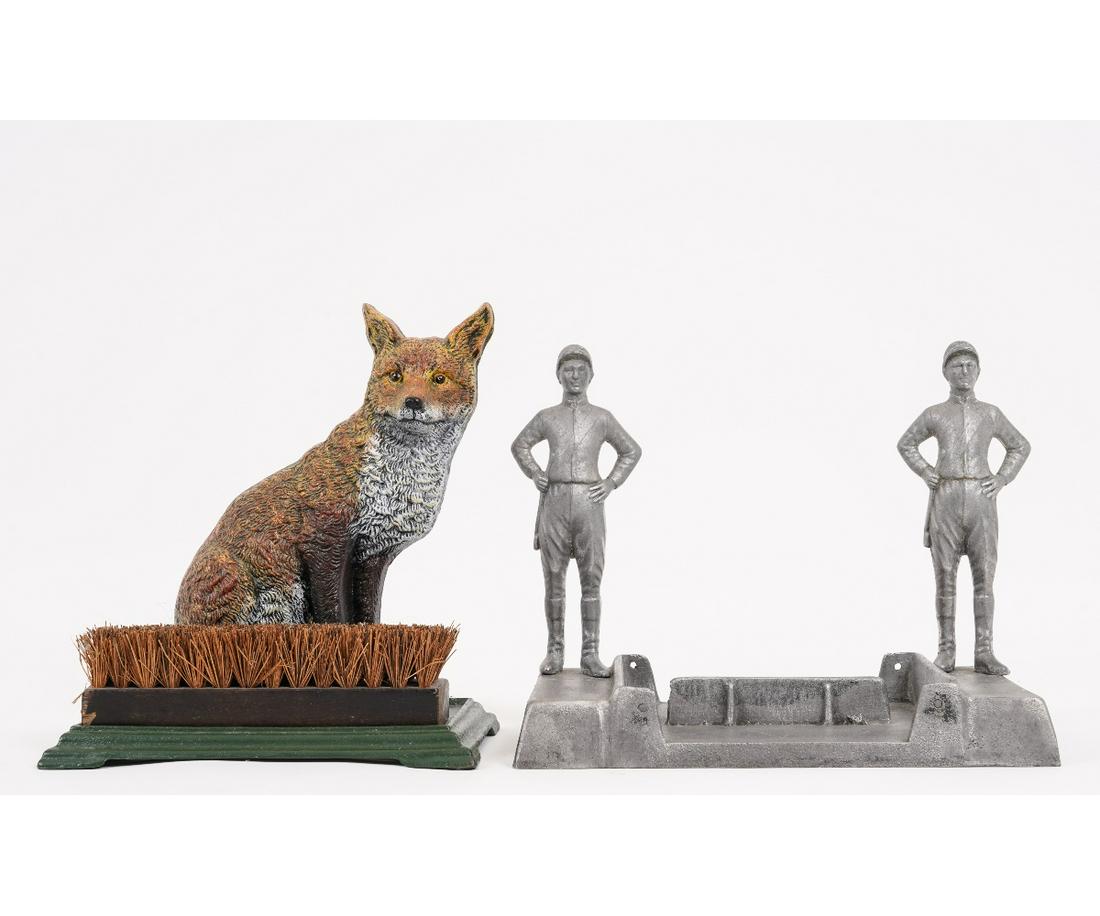 CAST IRON BOOT SCRAPE: Aluminum cast iron jockey boot scrape. 11"h x 13"w x 8"w; together with a cast iron painted fox boot brush, 11.5"h