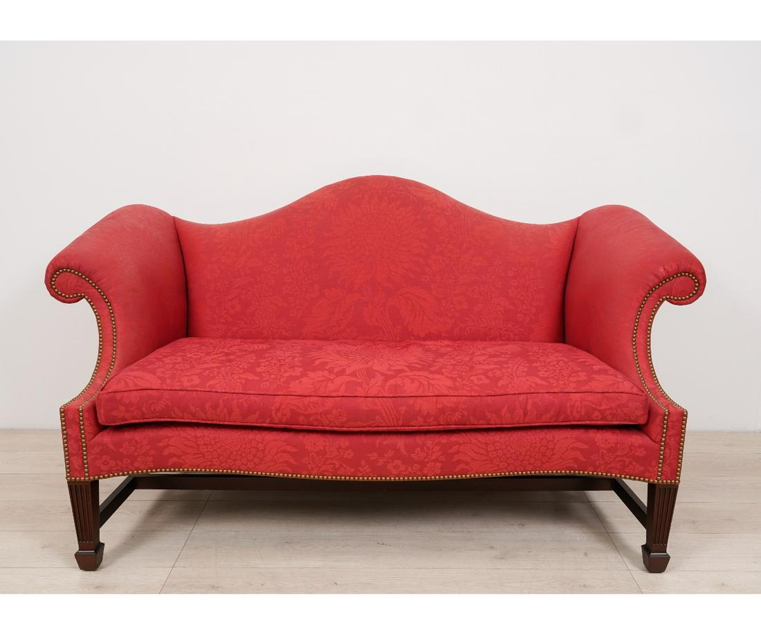 KINDEL CHIPPENDALE STYLE SOFA: Kindel Chippendale style mahogany, Winterthur Reproduction, camelback sofa with spade feet. 39"h x 69"l x 24"d / 18" seat height
