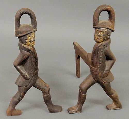 Small pair of cast iron Hessian soldier andirons.: Small pair of cast iron Hessian soldier andirons. 12"h.x14"w.