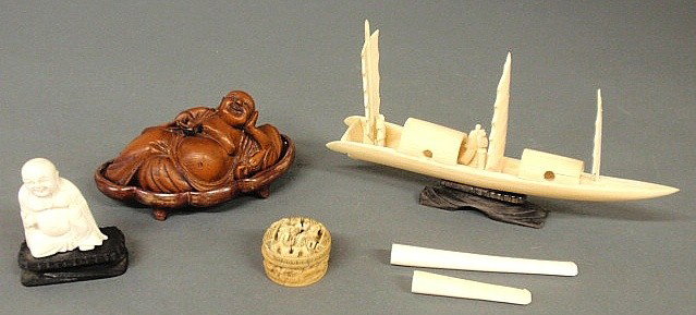 Group of oriental carved ivory items- Buddha, sma: Group of oriental carved ivory items- Buddha, small covered box, two pipe tips, Chinese junk ship 8"l., and a carved wood Buddha.