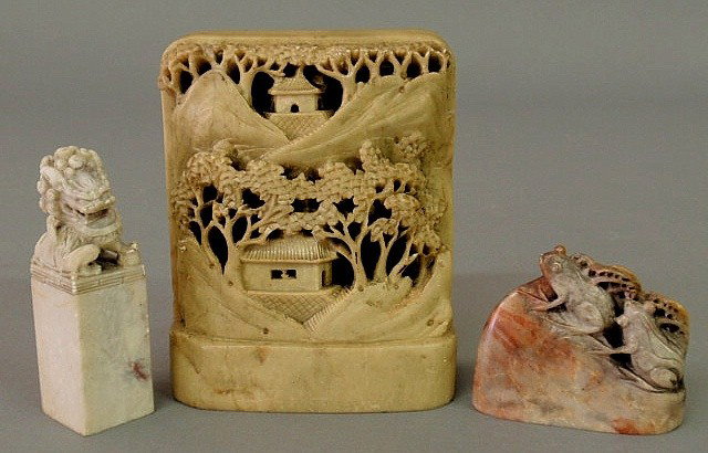 Three pieces of carved soapstone- Foo dog on plint: Three pieces of carved soapstone- Foo dog on plinth, house, temple & mountains with cherry trees 5.5”h.x4.5”w., and a pair of frogs.