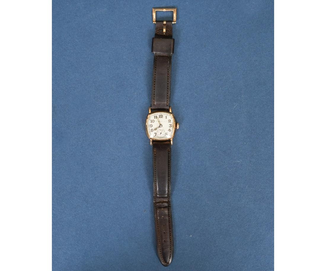 MEN'S GOLD WRIST WATCH: Men's Longines Swiss14k gold wrist watch, circa 1930's, 15 jewels, serial # 4859074, retailed by J.E. Caldwell & Co., manual wind, luminous hands, leather band. Dial: 1"dia / overall length: 9.25"l /1