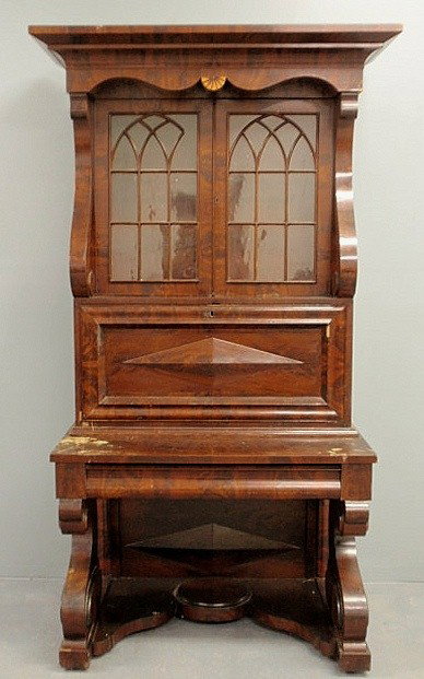 Empire mahogany secretary bookcase with bold inla: Empire mahogany secretary bookcase with bold inlaid cornice, two arched glass doors above a fall-front, single drawer and heavy scrolled legs. 82"h.x41"w.x26"d.
