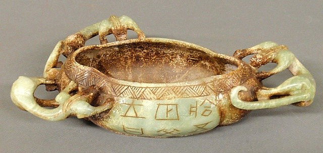 Asian green/brown hard stone oblong bowl with thr: Asian green/brown hard stone oblong bowl with three carved leopards and inscribed writings. 3"h.x12"l.x7"d.