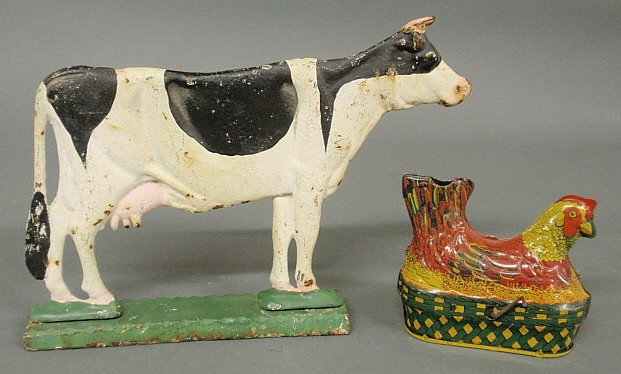 Cast iron cow doorstop 9"h.x12"l., c.1900, and a : Cast iron cow doorstop 9"h.x12"l., c.1900, and a chicken printed-on-tin toy 4.5"h.