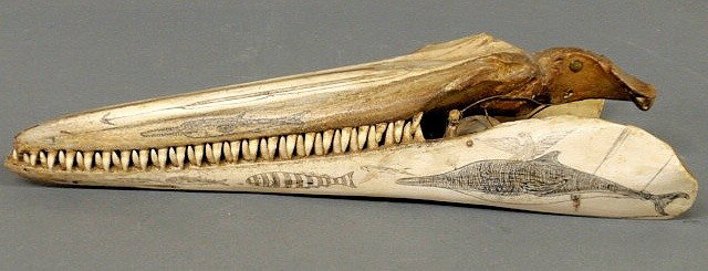 Scrimshaw porpoise jaw with carved harpoon and se: Scrimshaw porpoise jaw with carved harpoon and sea life designs, 19th c. 16.5"l.