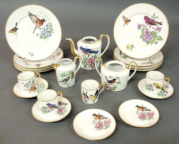 Partial Limoges dessert service with colorful bir: Partial Limoges dessert service with colorful bird, floral and gilt decoration to include: 8 plates 7.5", five saucers 4.25", 4 cups 2.25", creamer 3.5", sugar pot 4" (lacking lid) and coffeepot 4.5" 
