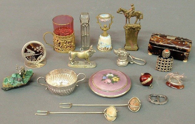 Misc. grouping to include: London silver 1708 toy: Misc. grouping to include: London silver 1708 toy porringer 1"h., two silver watch fobs, a dog and a fox, brass horse-form stamp, purple enameled compact, miniature cranberry glass and brass mug, two 
