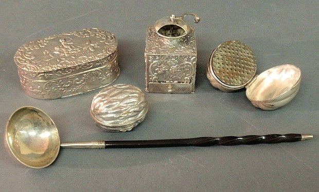 English silver nutmeg grater in the form of a nut: English silver nutmeg grater in the form of a nut, a sterling silver example, two 19th c. Continental silver nutmeg graters, one decorated with a boy and bee 1.5"h., one with a turn handle 2.25"h. and