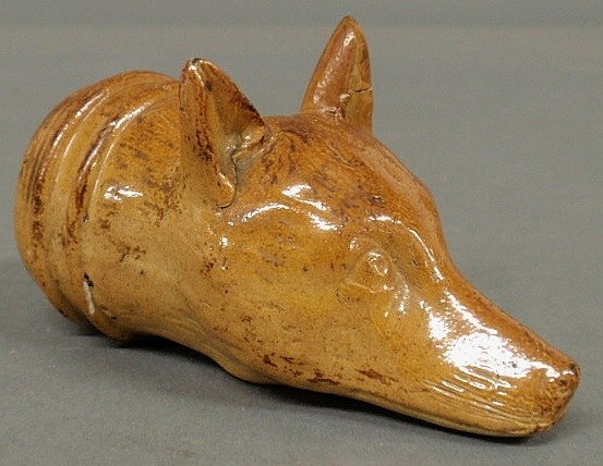 English ceramic fox head bottle advertising "R. H: English ceramic fox head bottle advertising "R. Hill Wine and Spirits Merchants", 19th c., repair to one ear. 5.5"l.