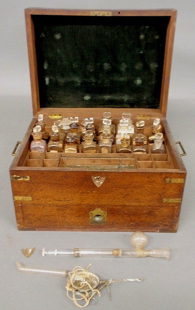 American mahogany cased and brass-bound apothecar: American mahogany cased and brass-bound apothecary chest, c,1820, with multiple bottles. 8.5"h.x15"w.x11.25"d.