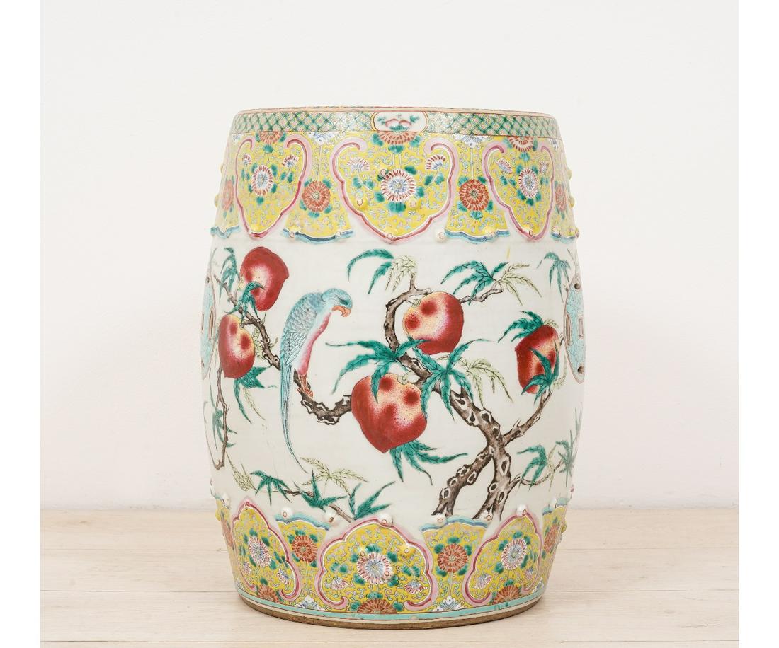 CHINESE PORCELAIN GARDEN SEAT: Chinese porcelain garden seat, 19th c., decorated with pomegranates, birds, and repeating yellow panels with flowers. 18.75"h x 13"dia
