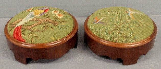 Pair of small round mahogany stools with needlepo: Pair of small round mahogany stools with needlepoint tops with bird and tree motifs. 4.5”h.x11”diam.