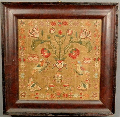 Wool on linen sampler wrought by Catharine Sutphi: Wool on linen sampler wrought by Catharine Sutphin, 1841, with potted flowers, birds and butterflies and mounted in a mahogany veneered frame. 16”x16”