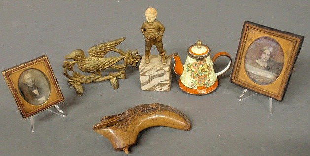 Misc. grouping to include: a carved alligator for: Misc. grouping to include: a carved alligator form can handle, 2 daguerreotypes, metal boy figure with carved ivory head 5.5”h., Kelvin Chen enameled coffeepot and a gilt metal bird.