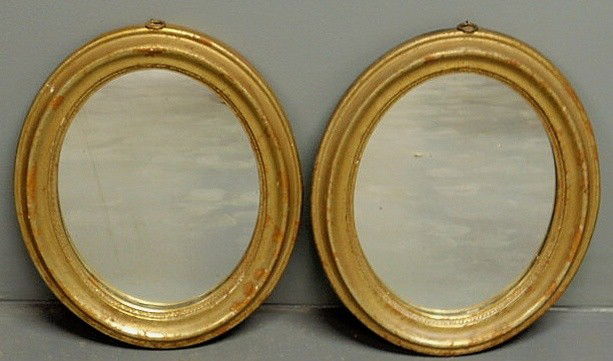 Small pair of oval gilt decorated mirrors. 13”x10: Small pair of oval gilt decorated mirrors. 13”x10.5”