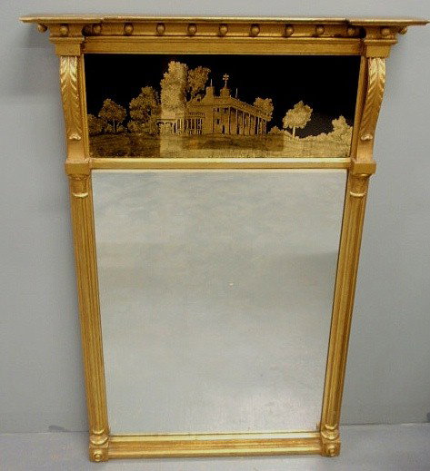 Sheraton style gilt decorated mirror with reverse: Sheraton style gilt decorated mirror with reverse painted glass panel of Mt. Vernon. 38”x26.5”