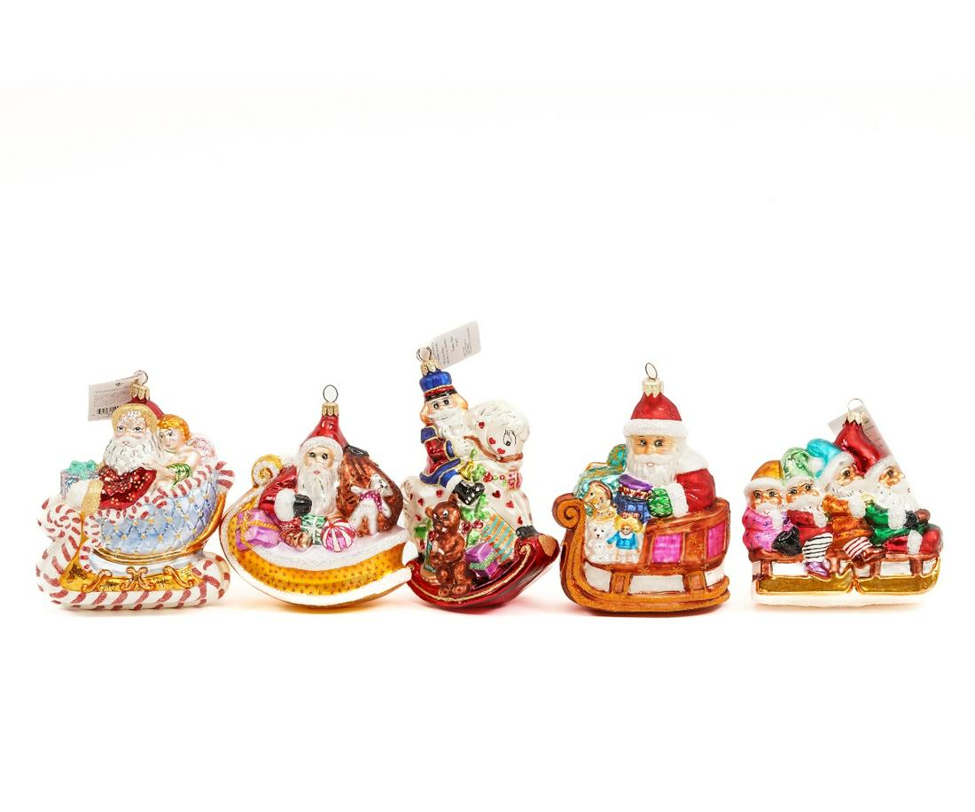 CHRISTOPHER RADKO ORNAMENTS: Five large Santas on sleighs, all different. Approx 6"h
