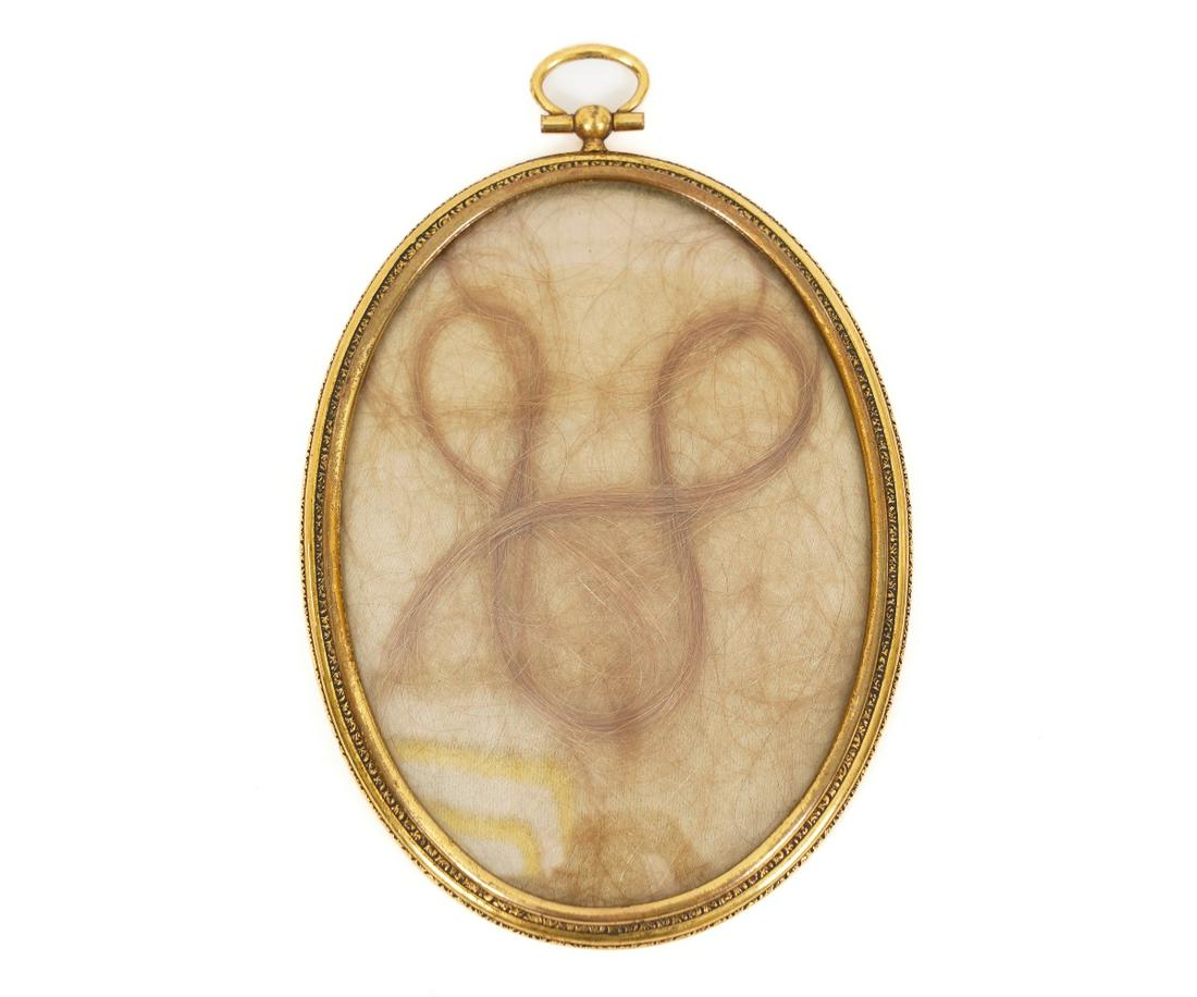 CASED SOUVENIER HAIR LOCKET: Gold filled oval cased hair locket inscribed "Souvenir der Konigin Louise von Preussen", Queen of Prussia (Louise of Prussia, 1776-1810) wife of Frederick William III of Prussia (1793-1810). 5.5" x 3.