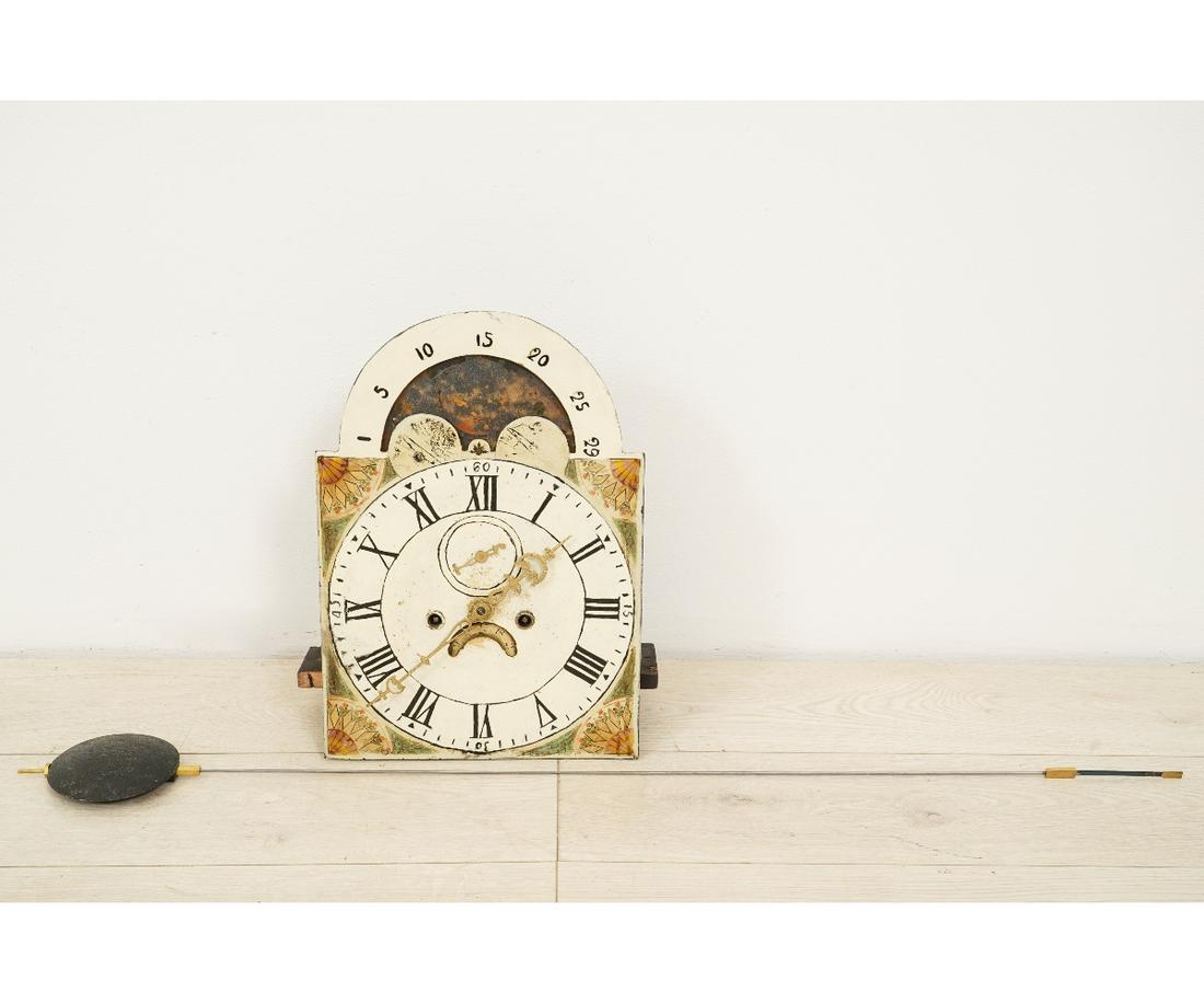TALL CASE CLOCK MOVEMENT: 8-day tall case clock movement with moon dial, Roman numerals and calendar wheel. 17.25"h x 12"w