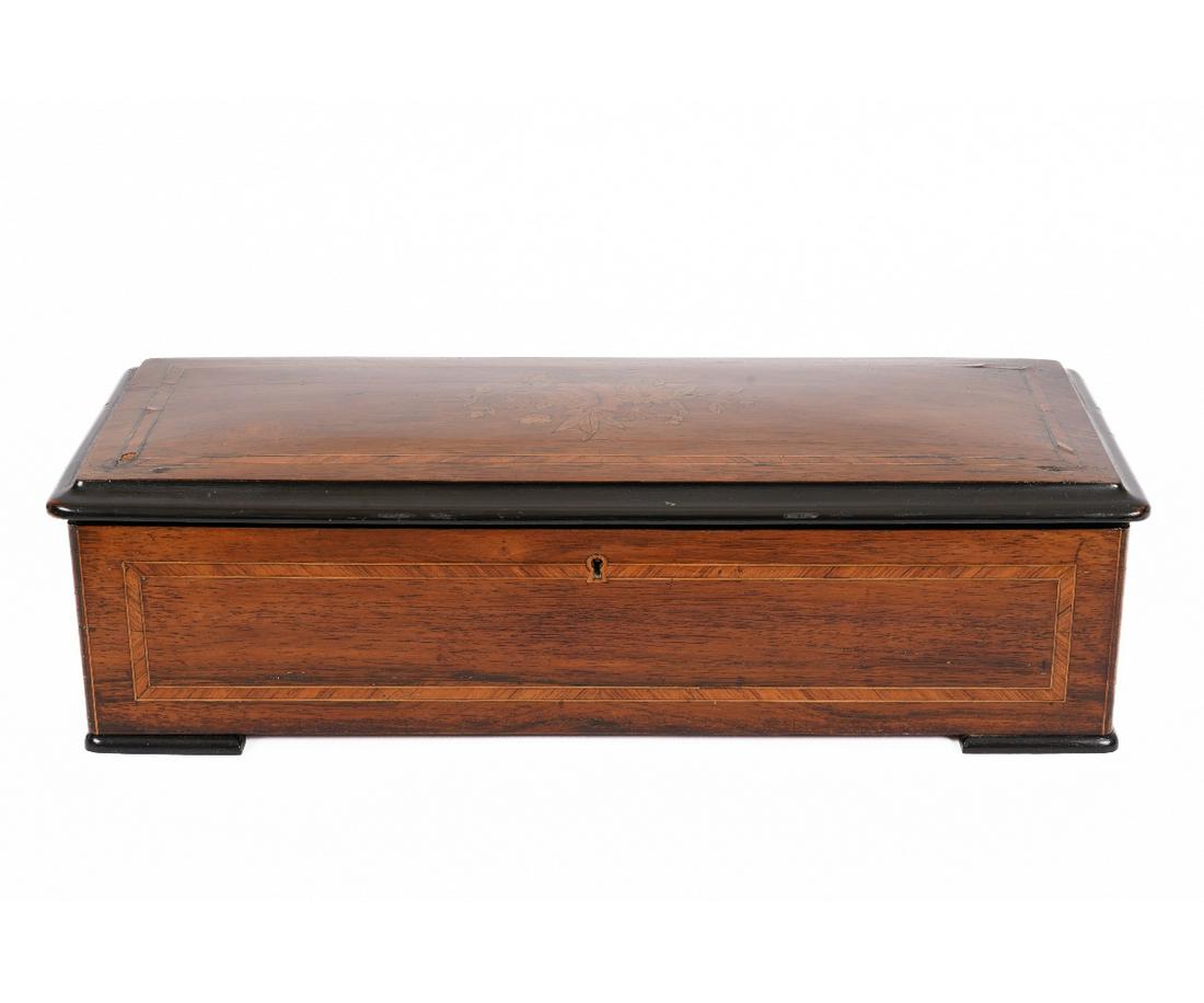 SWISS MUSIC BOX: Swiss music box with inlaid case and 11" cylinder. 6"h x 22"w x 9"d