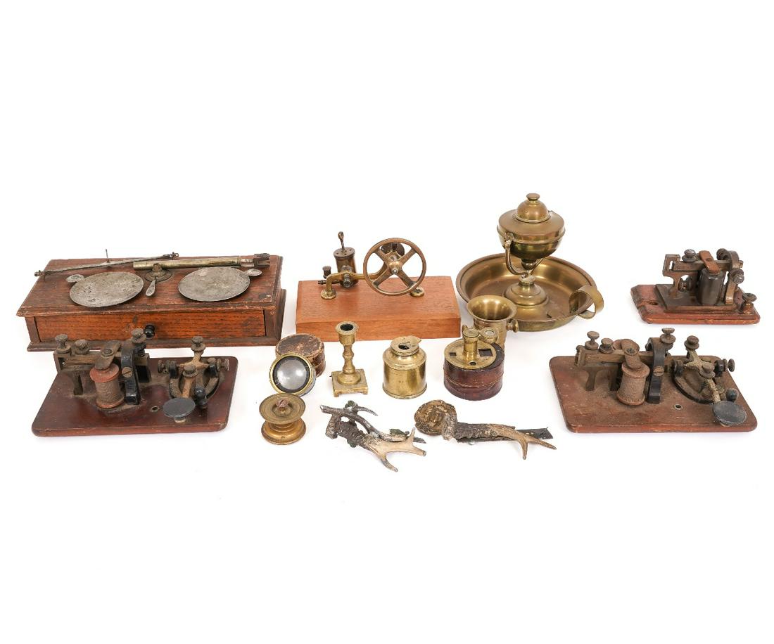 MISCELLANEOUS DEVICES: Cased scale, gimbaled brass chamber stick, morse code telegraph keys, brass lenses, steam engine (incomplete) and other miscellaneous devices. Largest telegraph: 3"h x 7"w x 4.5"d